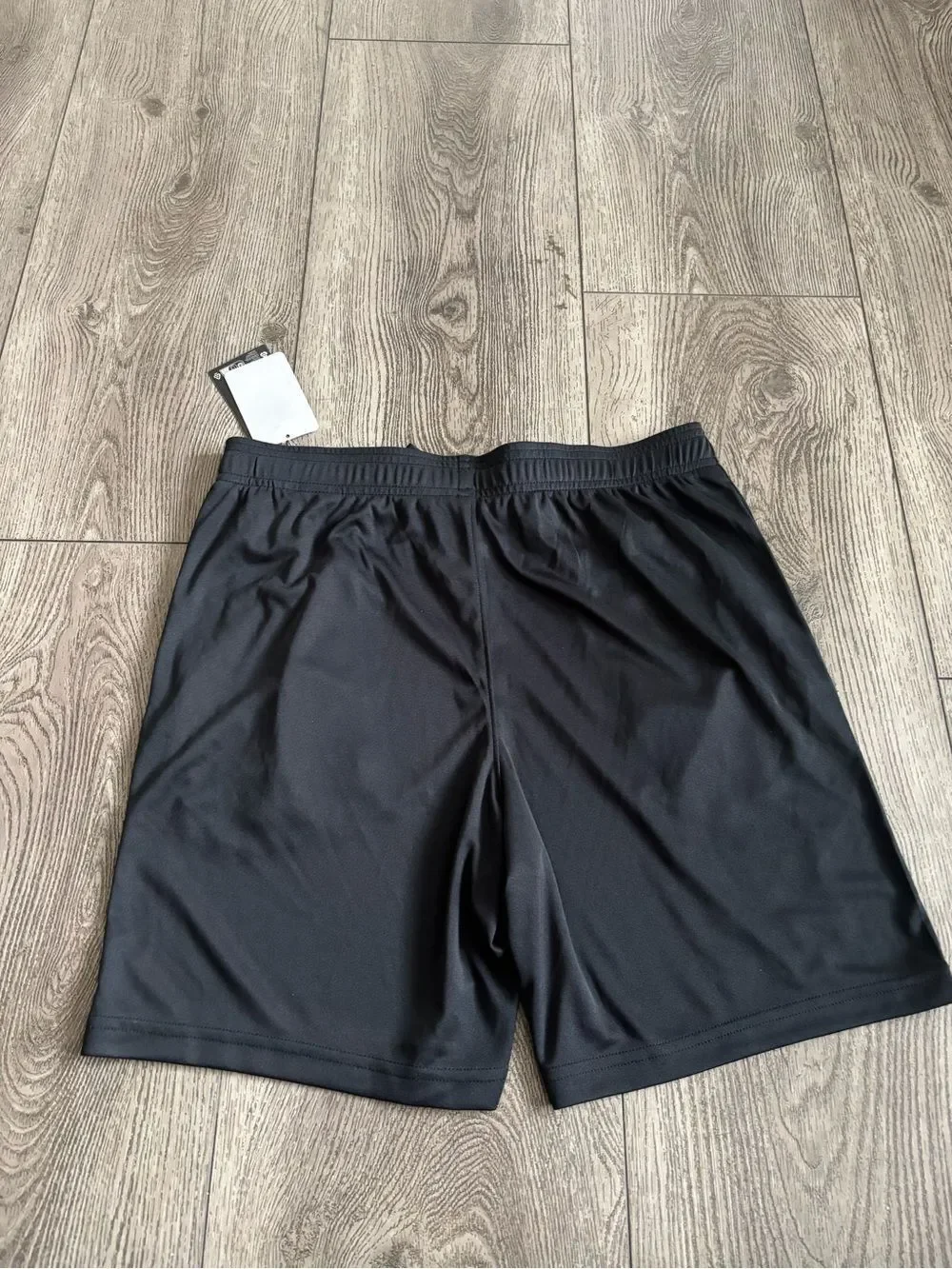 Under Armour boys Black Performance Shorts with Yellow Logo